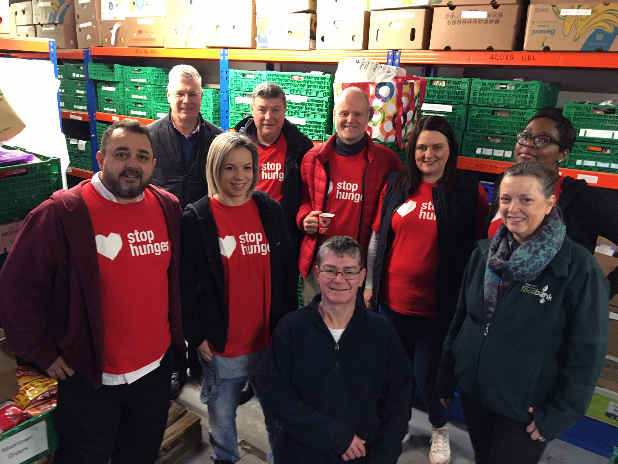 Stop Hunger volunteers and Karen at the food bank